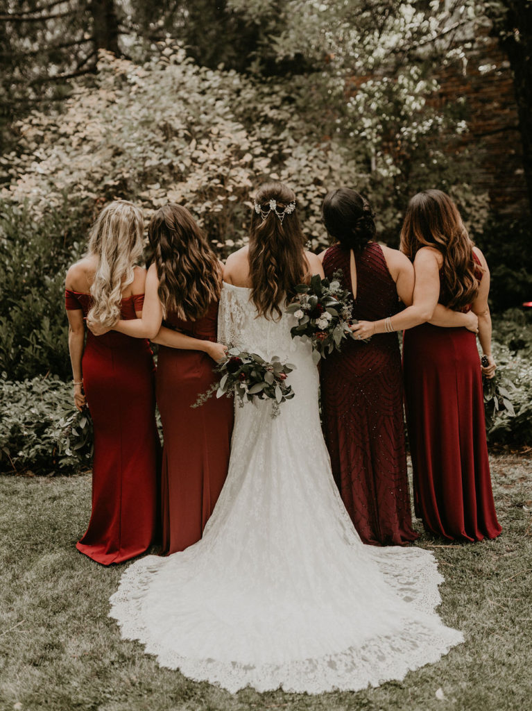 bride and bridesmaid red dresses | Twenty Mile House Wedding Amongst the Redwoods